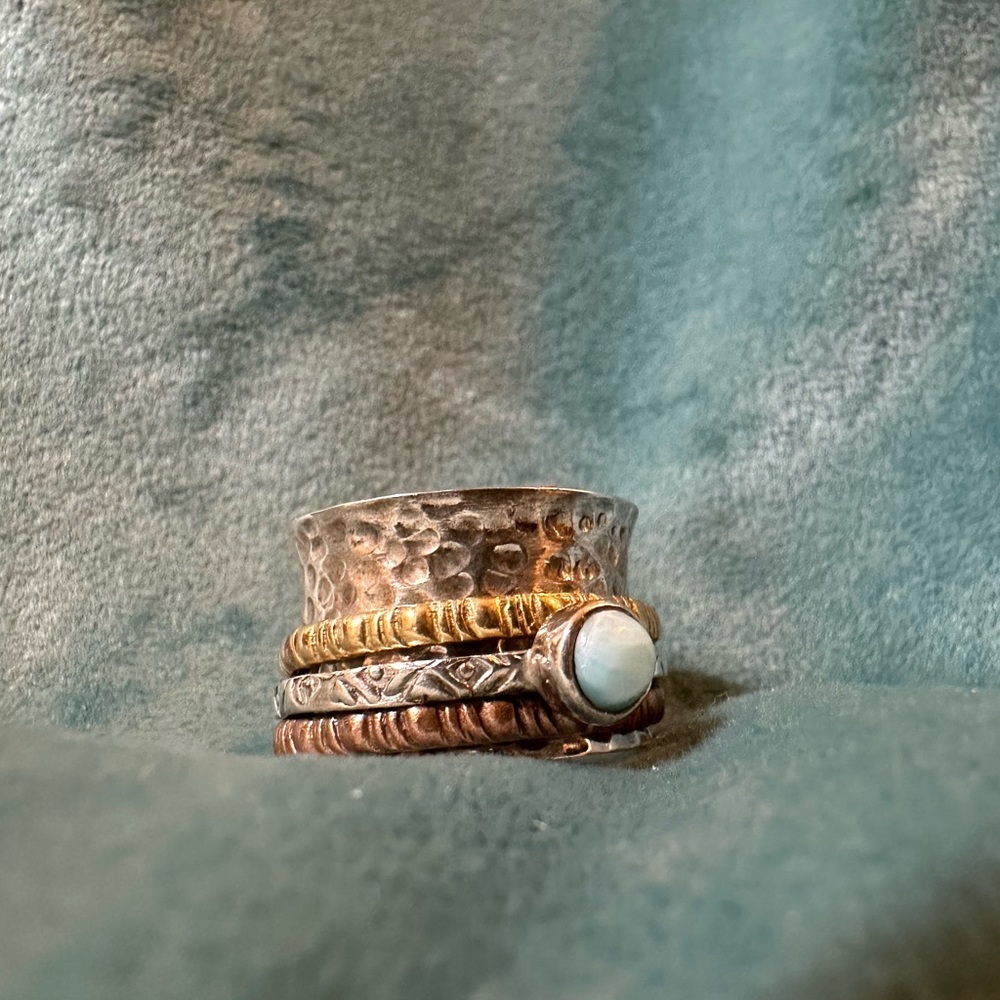 DBM Kensington spinner ring. 925 silver and aquamarine stone. Anxiety ring